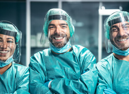 Surgeons smiling after a successful surgical operation - Medical workers the real heroes during corona virus outbreak - Doctor working for stop and preventing spread of coronavirus concept